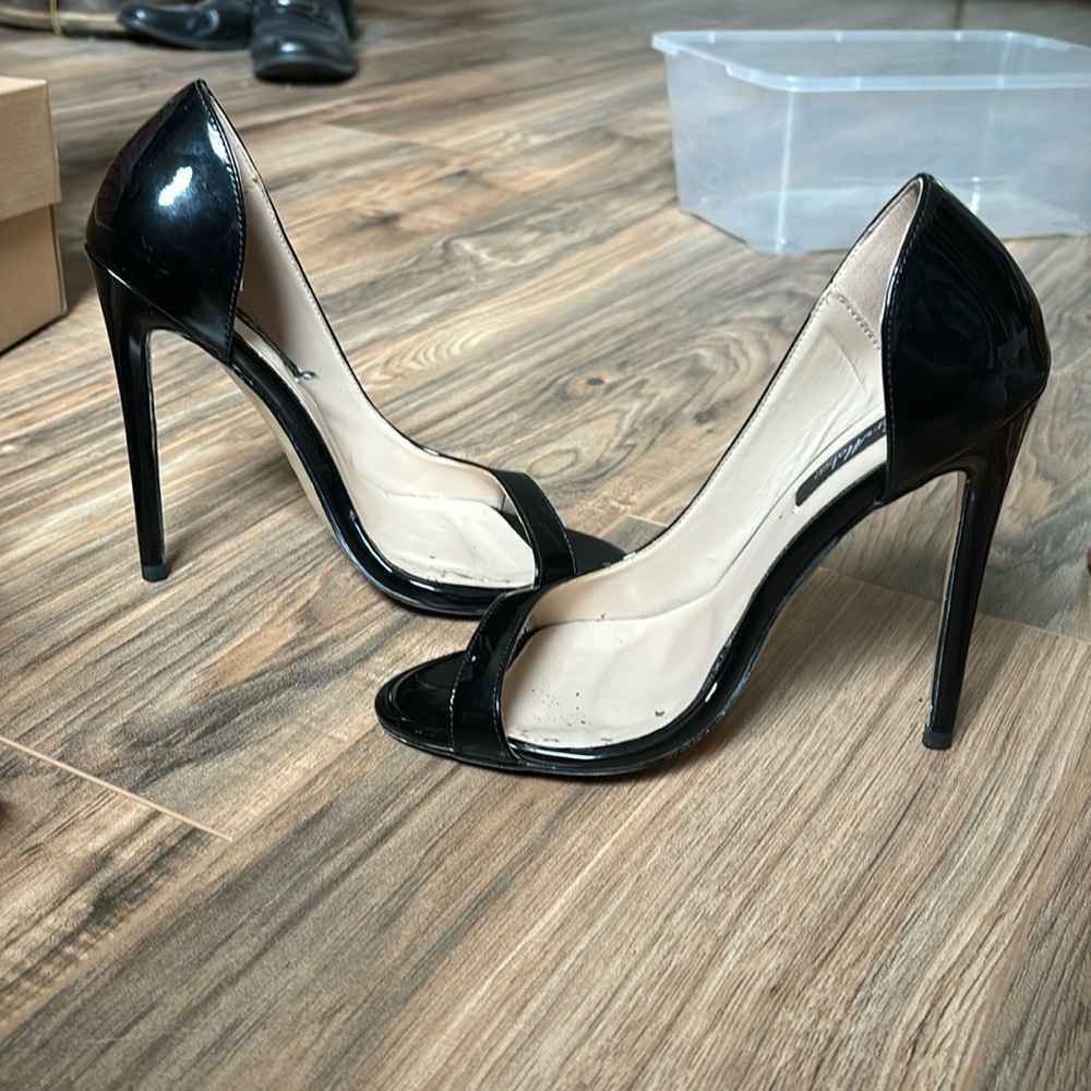 Very high black strap open shoe